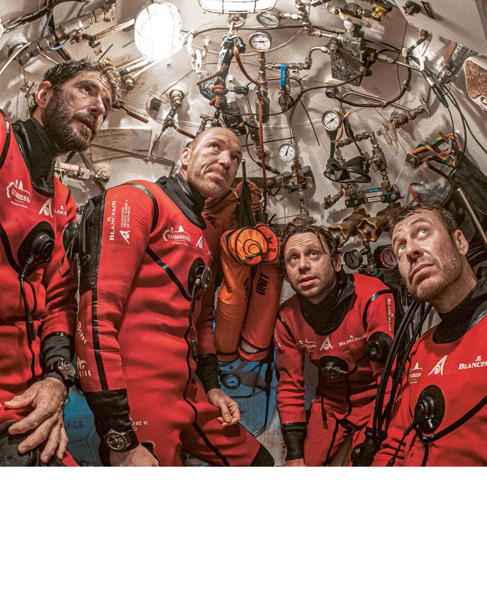 The aquanauts in the descent module after a dive.
