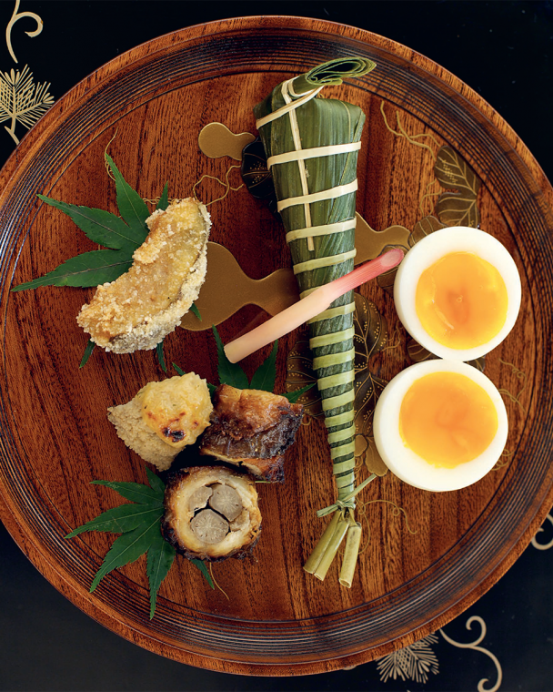 The famous Hyotei egg with fig, eel and sushi.
