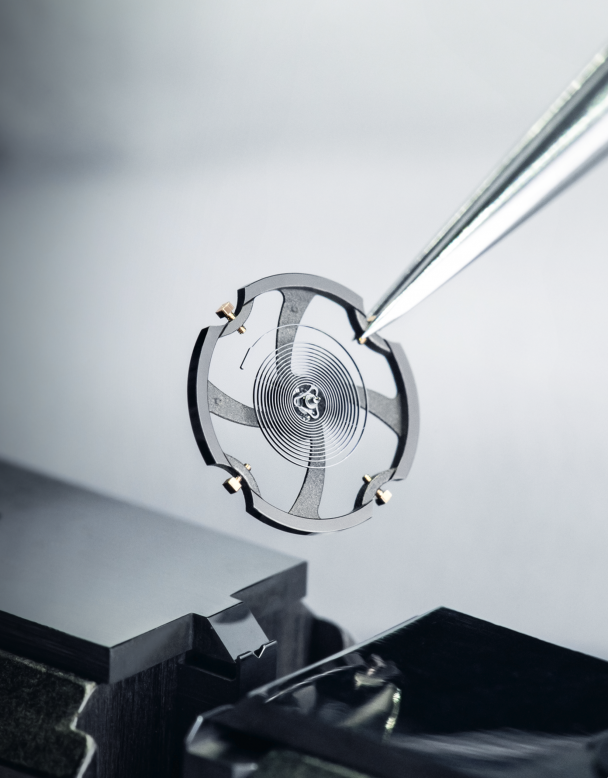 Blancpain’s titanium balance wheel with gold regulation screws.
